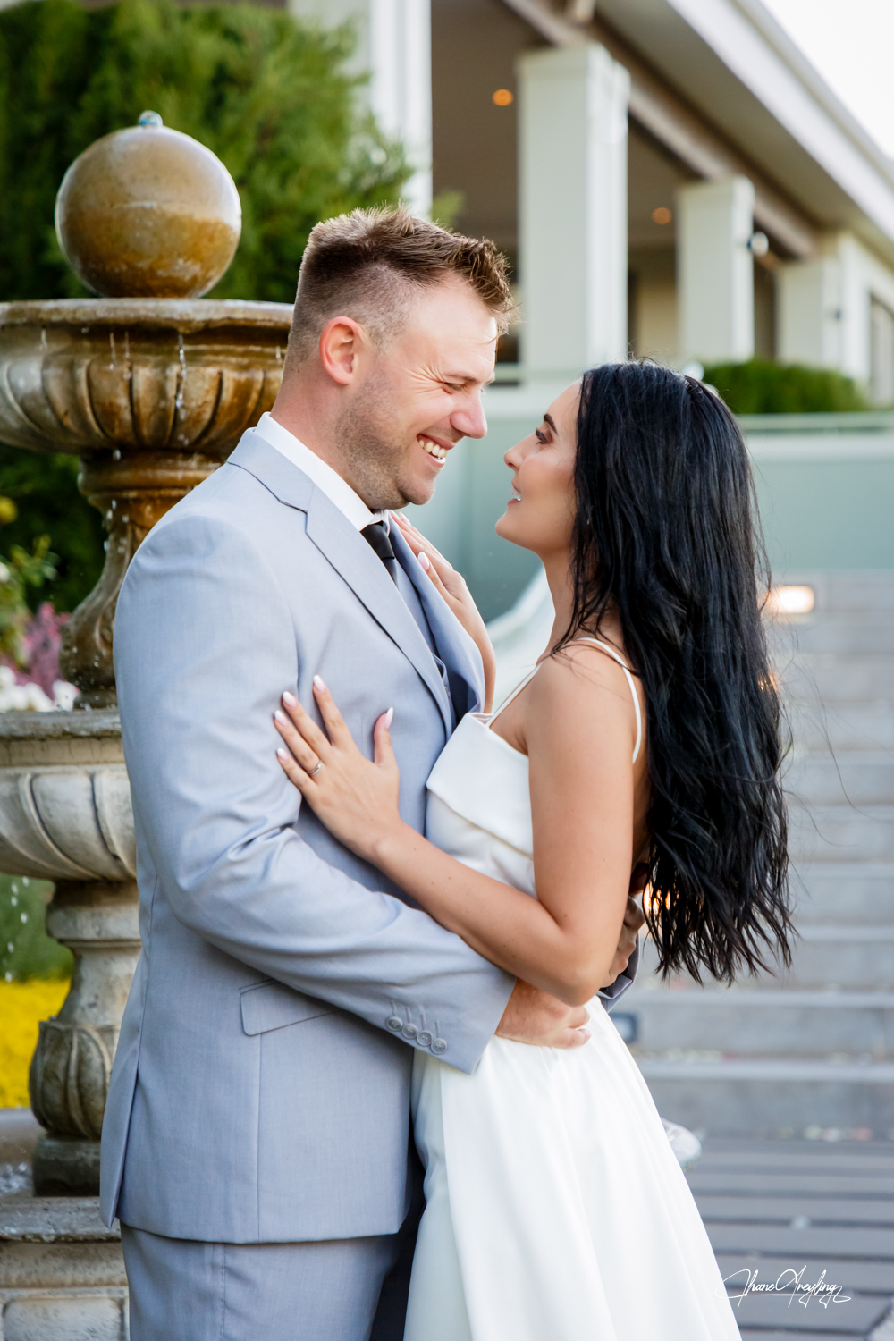 Joyful South African couple sharing a tender moment, feeling comfortable on camera.
