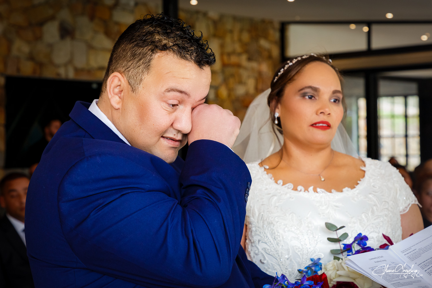 Couple sharing a tender moment, showcasing elegant bridal styles in a beautiful Cape Town setting.
