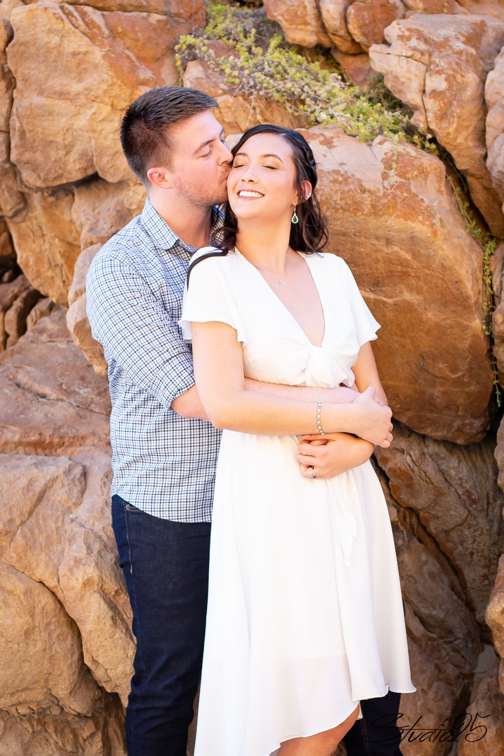 Joyful South African couple sharing a laugh, essential to any wedding planner checklist.